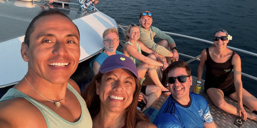 GAS'D travelers enjoying dinner together during a group dive trip