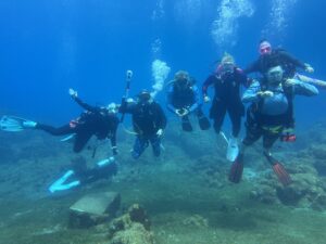 GAS'D group scuba diving together on a group dive trip in Dominica