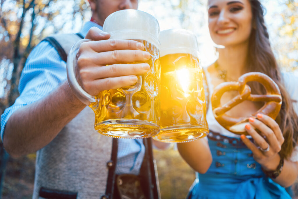 Couple experiencing Oktoberfest atmosphere in Germany